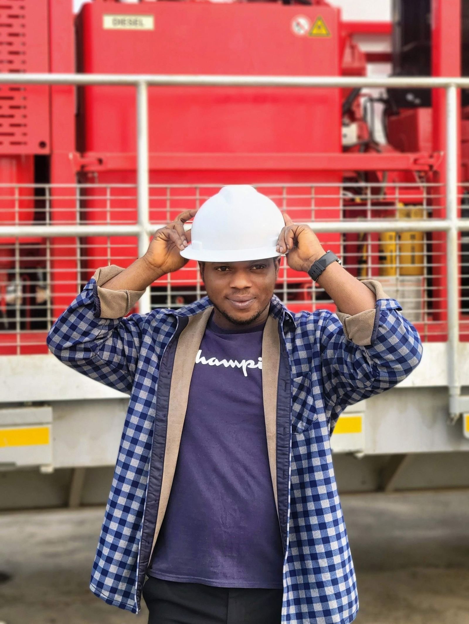 Technician in safety gear at an industrial facility