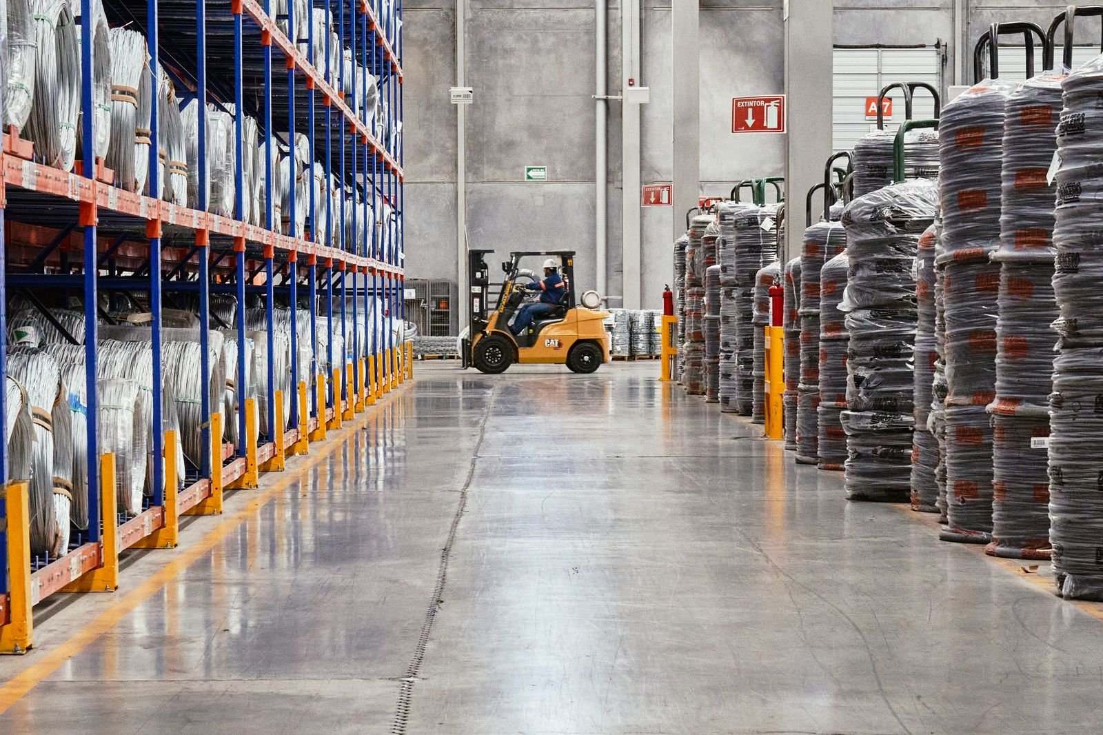 Forklift moving equipment in a supply warehouse